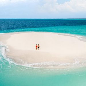 Maldives Honeymoon Package InterContinental Maldives Maamunagau Resort Couple On Sandbank