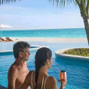 Maldives Honeymoon Package InterContinental Maldives Maamunagau Resort Couple In Main Pool