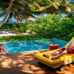 Maldives Honeymoon Packages Mercure Maldives Kooddoo Resort Couple Relaxing By The Pool