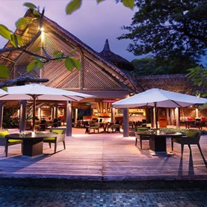 Constance Ephelia - Luxury Seychelles Honeymoon Packages - Adam and Eve restaurant and bar exterior at night