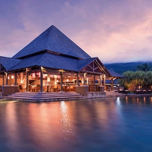 Constance Ephelia - Luxury Seychelles Honeymoon Packages - Corossol restaurant exterior at night