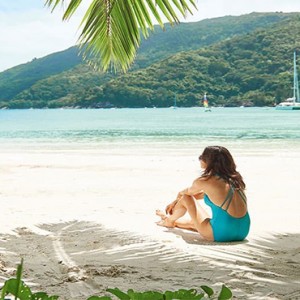 Constance Ephelia - Luxury Seychelles Honeymoon Packages - woman on beach