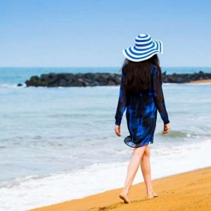 Woman Strolling On Beach The Fortress Resort & Spa Sri Lanka Honeymoons