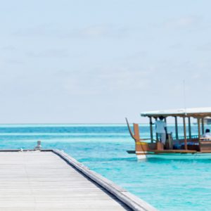 Maldives Honeymoon Packages Conrad Maldives Rangali Island Woman On Bridge