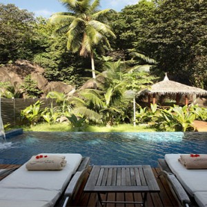 Hilton Seychelles Labriz Resort & Spa - Luxury Seychelles Honeymoon Packages - Sanctuary Pool Villa sun loungers by pool