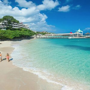 Jamaica Honeymoon Packages Sandals Ochi Beach Resort Couple Walking On Beach1