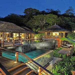 Constance Lemuria - Luxury Seychelles Honeymoon Packages - Presidential villa exterior at night