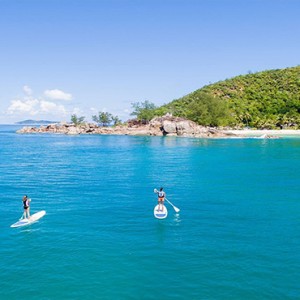 Constance Lemuria - Luxury Seychelles Honeymoon Packages - stand up paddling