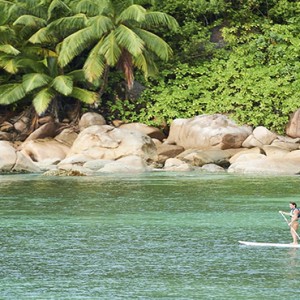 Constance Lemuria - Luxury Seychelles Honeymoon Packages - stand up paddling