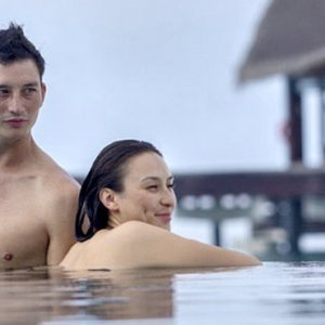 Couple In Pool The Residence Maldives At Falhumaafushi Maldives Honeymoons