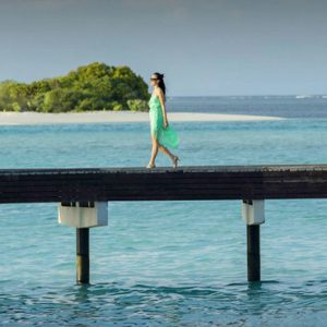 Woman On Jetty The Residence Maldives At Falhumaafushi Maldives Honeymoons