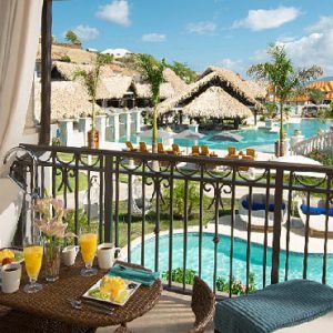 Grenada Honeymoon Packages Sandals Grenada South Seas Waterfall River Pool Junior Suite With Balcony Tranquility Soaking Tub2