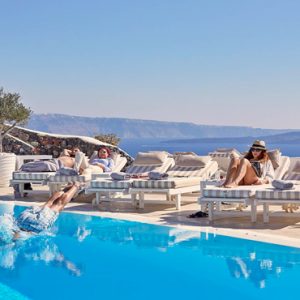 Greece Honeymoon Packages Canaves Oia Suites Relaxing By Infinity Pool