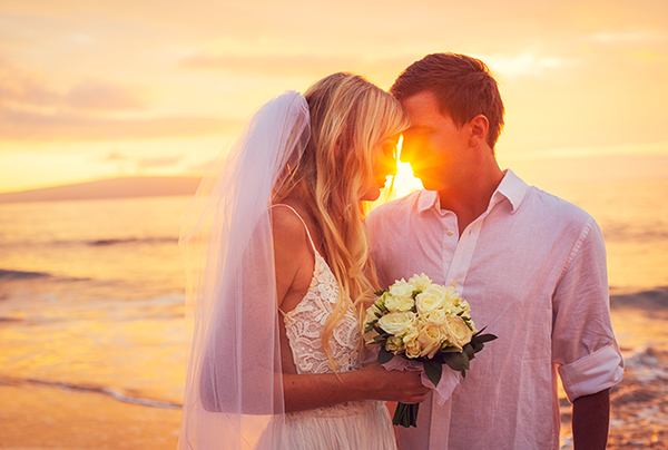 Bride and Groom, Enjoying Amazing Sunset on a Beautiful Tropical