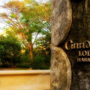 Sri Lanka Honeymoon Package - Cinnamon Lodge Habarana - Hotel logo on tree