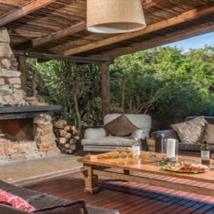 Kariega Game Reserve - Luxury South Africa Honeymoon Packages - Main lodge living area with fireplace