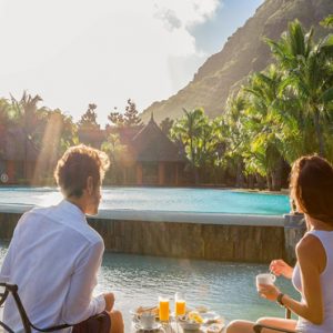 Mauritius Honeymoon Packages Dinarobin Beachcomber Golf Resort & Spa Couple On Honeymoon By Pool