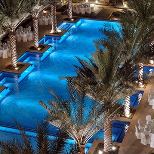 the palace downtown dubai - dubai luxury honeymoon packages - pool at night