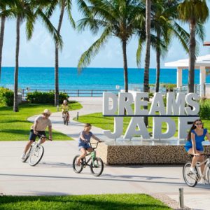 Mexico Honeymoon Packages Dream Jade Resort & Spa Family Riding Bikes