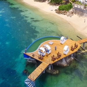 Coco de Mer & Black Parrot Suites - Luxury Seychelles Honeymoon Packages - aerial view of jetty