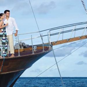 Maldives Honeymoon Packages Shangri La’s Villingili Resort And Spa Couple At The Bow Of Horizon The Resort's Luxury Yacht
