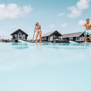 Maldives Honeymoon Packages Shangri La’s Villingili Resort And Spa Standup Paddleboarding In The Lagoon