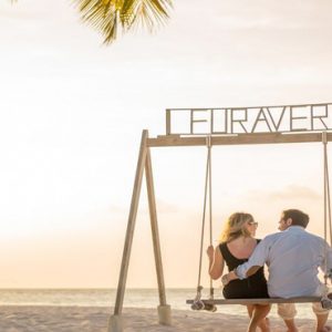 Maldives Honeymoon Packages Furaveri Island Maldives Couple On Beach Swing