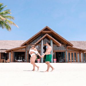 Maldives Honeymoon Packages Furaveri Island Maldives Couple Walking On Beach