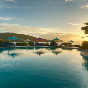 Daydream Island Resort & Spa - Australia Honeymoon Packages - pool in the sunset