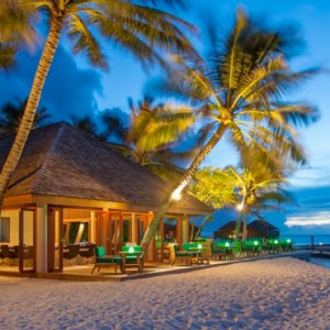 Veligandu Island Resort & Spa - Maldives Honeymoon Packages - Athiri Bar Exterior at Evening