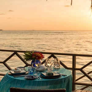 Four Seasons Resort Maldives at Kuda Huraa - Maldives Honeymoon Packages - in bungalow romantic dining