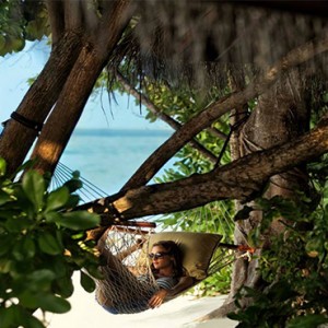 Four Seasons Resorts at Landaa Giraavaru - Maldives Luxury Honeymoon Packages - hammock on beach