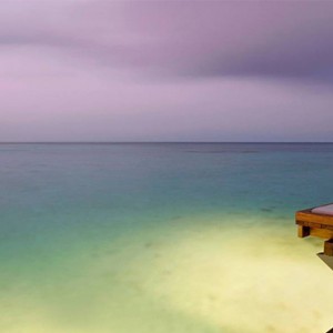 Four Seasons Resorts at Landaa Giraavaru - Maldives Luxury Honeymoon Packages - relaxing on deck