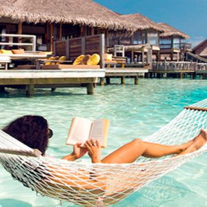 Maldives Honeymoon Packages Gili Lankanfushi Woman Relaxing In Hammock