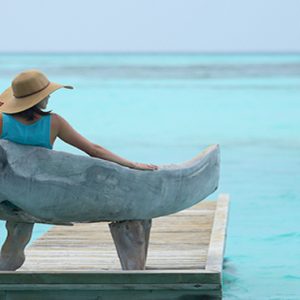 Maldives Honeymoon Packages Gili Lankanfushi Woman Relaxing On Deck