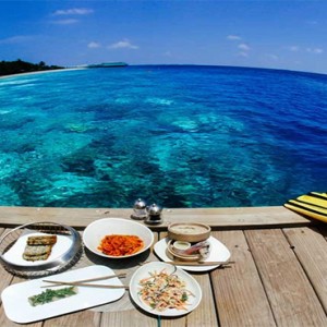 Amilla Fushi - Maldives Honeymoon packages - meal on deck