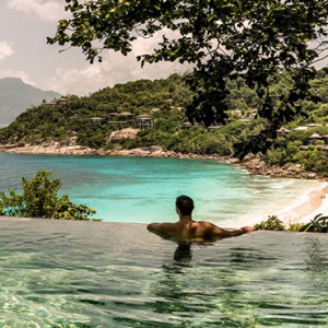 Four Seasons Resort Seychelles - Luxury Seychelles Honeymoon packages - man in pool