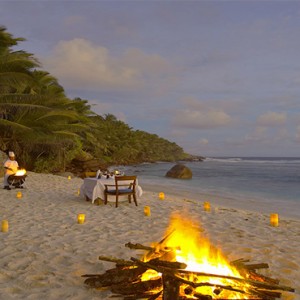 Fregate Island Private - Luxury Seychelles Honeymoon Packages - candlelit dinner on beach