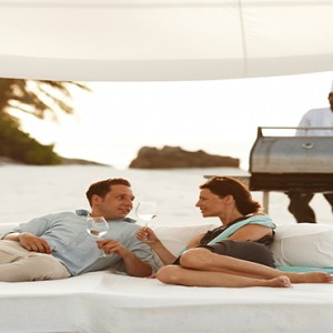 Fregate Island Private - Luxury Seychelles Honeymoon Packages - couple on cabana