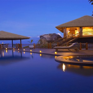 Fregate Island Private - Luxury Seychelles Honeymoon Packages - villa pool at night
