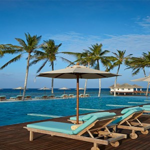 Loama Resort Maldives at Maamigili - Luxury Maldives Honeymoon packages - Day bed by pool