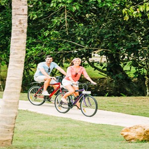 Anantara Peace Haven Tangalle Resort - Luxury Sri Lanka Honeymoon packages - couples on a bike ride