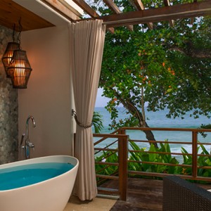 Oceanfront Two-Story One Bedroom Butler Villa Suite with Balcony Tranquility Soaking Tub - sandals regency la toc - luxury st lucia honeymoons