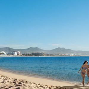 Couple on the beach - Breathless Cabos San Lucas - Luxury Mexico Honeymoon Packages