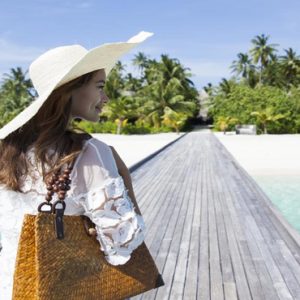 Woman On Jetty Outrigger Konotta Maldives Resort Maldives Honeymoons