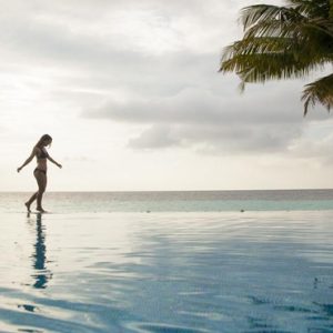 Women Walking By Pool Outrigger Konotta Maldives Resort Maldives Honeymoons