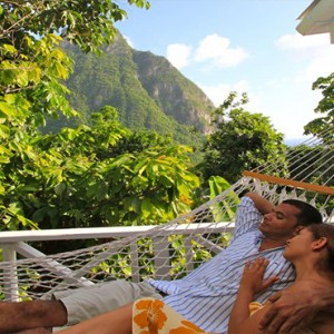 Southfield Estate Resort - Luxury St Lucia honeymoon Packages - Couple relaxing in hammock