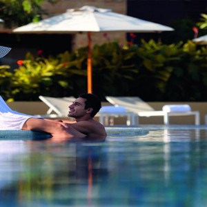 Movenpick Resort and Spa Jimbaran Bali - Luxury Bali Honeymoon Packages - couple by pool