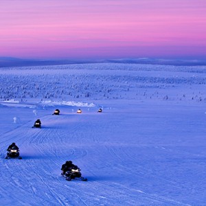 Kakslauttanen Arctic Resort - Luxury Finland Honeymoon Packages - snow mobile