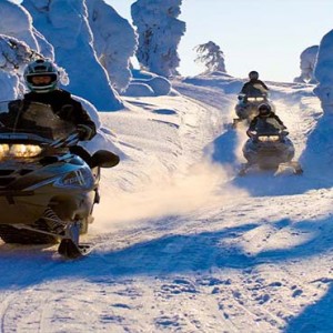 Kakslauttanen Arctic Resort - Luxury Finland Honeymoon Packages - snow mobile1